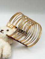 Waterproof 18K gold 14 piece textured bangle stack Biya Accessoires UAE gift for her