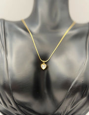Waterproof small minimalist gold heart necklace on silk.