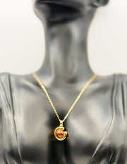 Hypoallergenic non-tarnish gold abstract sun and moon necklace.
