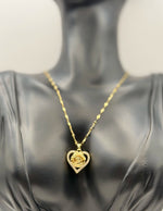 Waterproof gold floral heart necklace for women on white silk background.