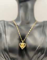 Waterproof gold floral heart necklace for women on white silk background.
