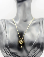 Waterproof gold key necklace with marquise crystals in luxury gift box.