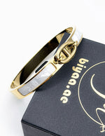 Waterproof gold white enamel hinge bracelet for women Dubai.