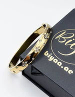 Waterproof gold quatrefoil stardust bracelet for women Dubai UAE.