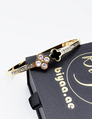 Waterproof gold dual quatrefoil channel set crystal bracelet for women Dubai.