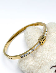 18K gold plated B monogram crystal bangle by Biya Accessoires.