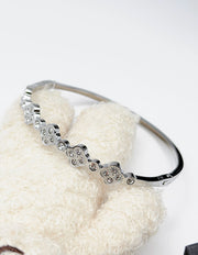Hypoallergenic non-tarnish high polish silver rigid floral bangle UAE.