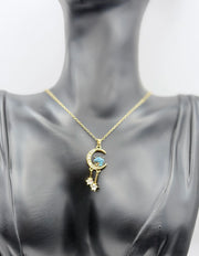 Waterproof celestial gold necklace with dangling crystal stars in gift box.