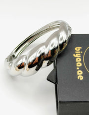 Luxury tarnish-free stainless steel sculptural jewelry for sensitive skin.