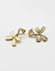 Biya Accessoires artificial jewellery online dubai pearl heart and enamel bow earrings.