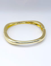 Gold bracelet on a white background