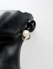 Close-up of premium hypoallergenic imitation jewelry featuring an asymmetrical pearl design.