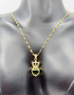 Hypoallergenic gold tiara and heart necklace with clear gemstone.