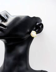Close-up of premium hypoallergenic imitation jewelry featuring a freeform gold design.