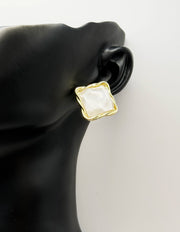 Close-up of premium hypoallergenic imitation jewelry featuring a textured gold design.