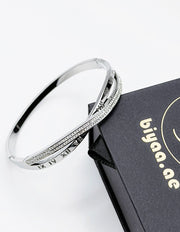 Silver bracelet on a black box with 'biyaa.ae' branding