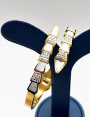 18K gold plated serpentine architectural bangle with pearl and crystals Biya Accessoires.
