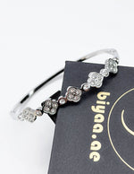 Modern luxury fine art editorial silver jewelry crystal clover bracelet gift for her.