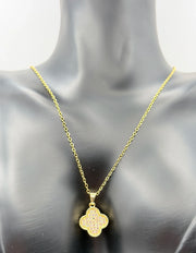 Gold necklace with a pendant on a mannequin