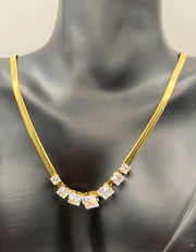 Waterproof gold snake chain necklace with graduated cubic zirconia.