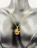 Modern luxury gold pendant necklace with brown gemstone Dubai.