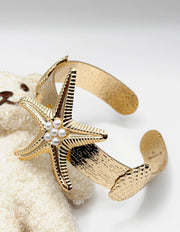 Hypoallergenic gold plated sea star open bracelet with pearls United Arab Emirates.