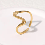 Modern luxury fine art editorial gold jewelry linear wave ring gift for her.