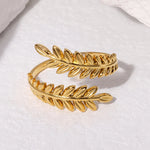 Modern luxury gold olive branch sculptural jewelry leaf ring gift.