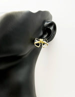 Best fashion jewelry in UAE black pearl inlay bow earrings for women.