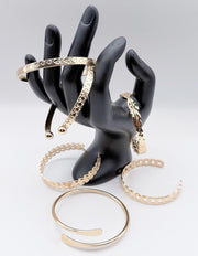 Waterproof 18K gold architectural bangle stack Biya Accessoires UAE.
