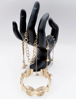 Waterproof 18K gold braided architectural bangle stack Biya Accessoires UAE.