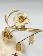Non-tarnish 3D botanical wrap armlet for women Dubai luxury fashion.