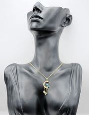 18K gold plated crescent moon and blue galaxy stone pendant by Biya Accessoires.