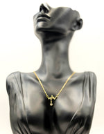 18K gold plated pavé crystal heartbeat necklace by Biya Accessoires.