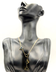 18K gold plated black butterfly lariat necklace by Biya Accessoires.