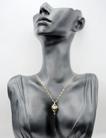 18K gold plated fluid wave pendant necklace with center crystal by Biya Accessoires.