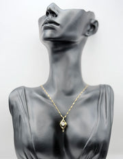 18K gold plated fluid wave pendant necklace with center crystal by Biya Accessoires.