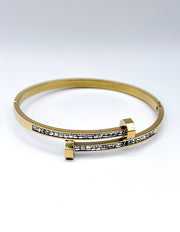 Waterproof gold bypass bangle with baguette crystals Biya Accessoires UAE.