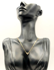 Waterproof gold dainty cluster heart pendant on silk Dubai.