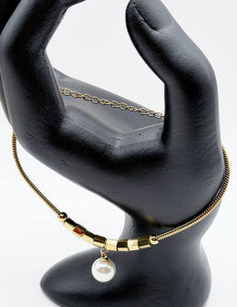 18K gold plated geometric pearl drop snake chain bracelet by Biya Accessoires.