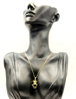18K gold plated panther pendant necklace with emerald green eyes by Biya Accessoires.