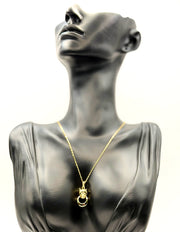 18K gold plated panther pendant necklace with emerald green eyes by Biya Accessoires.