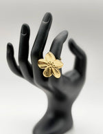 18K gold plated textured floral statement ring by Biya Accessoires.