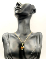18K gold plated open teardrop pendant with amber brown stone.