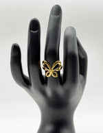 18K gold plated hollow butterfly open ring by Biya Accessoires.