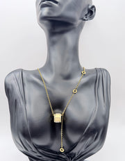 Designer style gold and crystal barrel necklace in luxury gift box.