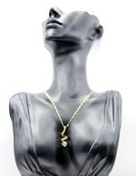 18K gold plated spiral solitaire pendant necklace by Biya Accessoires.