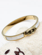 Hypoallergenic non-tarnish high polish gold architectural bangle UAE.