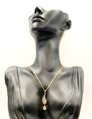 18K gold plated angel wing pendant with pear cut crystal drop by Biya Accessoires.
