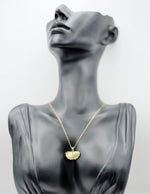 Biya Accessoires 18K gold plated open seashell necklace with pearl and pave crystals.